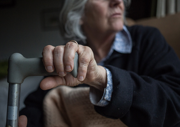 BRISTOL, ENGLAND - FEBRUARY 16: In this photo illustration an elderly person sits in a chair at home on February 16, 2015 near Bristol, England. The issues affecting the elderly, along with education and the economy are likely to be key elections issues in the forthcoming general election in May. (Photo by Matt Cardy/Getty Images)
