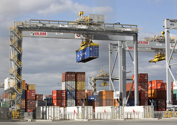 Shipping containers are pictured on the docks at DP World's London Gateway, container port at Corringham, east of London on April 10, 2017. / AFP PHOTO / Isabel Infantes (Photo credit should read ISABEL INFANTES/AFP/Getty Images)