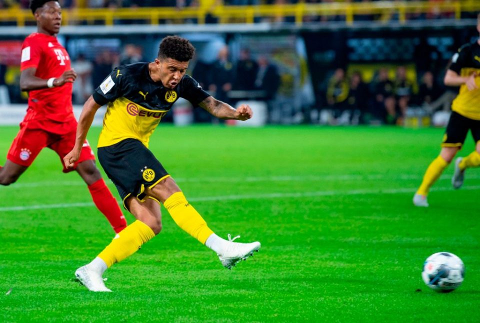 Dortmund's English midfielder Jadon Sancho scores the 2-0 goal during the German Supercup foorball match BVB Borussia Dortmund v FC Bayern Munich on August 3, 2019 at the Signal Iduna Park in Dortmund, western Germany. (Photo by Guido Kirchner / dpa / AFP) / Germany OUT (Photo credit should read GUIDO KIRCHNER/AFP/Getty Images)
