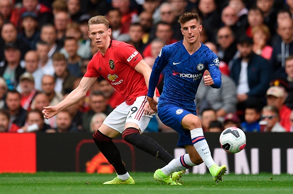 Chelsea's English midfielder Mason Mount (R) takes on Manchester United's English midfielder Scott McTominay (L) during the English Premier League football match between Manchester United and Chelsea at Old Trafford in Manchester, north west England, on August 11, 2019. (Photo by Oli SCARFF / AFP) / RESTRICTED TO EDITORIAL USE. No use with unauthorized audio, video, data, fixture lists, club/league logos or 'live' services. Online in-match use limited to 120 images. An additional 40 images may be used in extra time. No video emulation. Social media in-match use limited to 120 images. An additional 40 images may be used in extra time. No use in betting publications, games or single club/league/player publications. / (Photo credit should read OLI SCARFF/AFP/Getty Images)