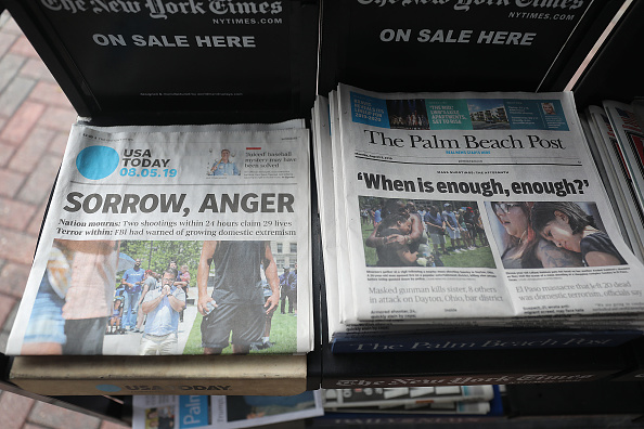PALM BEACH, FLORIDA - AUGUST 05: A GateHouse Media owned Palm Beach Post and the Gannett Co. owned USA Today are seen for sale at a newsstand on August 05, 2019 in Palm Beach, Florida. GateHose Media announced an agreement to acquire Gannett Co. Inc, which would create the largest local news publishing organization in the U.S. (Photo by Joe Raedle/Getty Images)