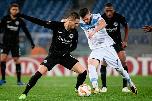 Frankfurt's Serbian midfielder Mijat Gacinovic (L) and Lazio's Kosovo midfielder Valon Berisha go for the ball during the UEFA Europa League group H football match Lazio Rome vs Eintracht Frankfurt on December 13, 2018 at the Olympic stadium in Rome. (Photo by Filippo MONTEFORTE / AFP) (Photo credit should read FILIPPO MONTEFORTE/AFP/Getty Images)