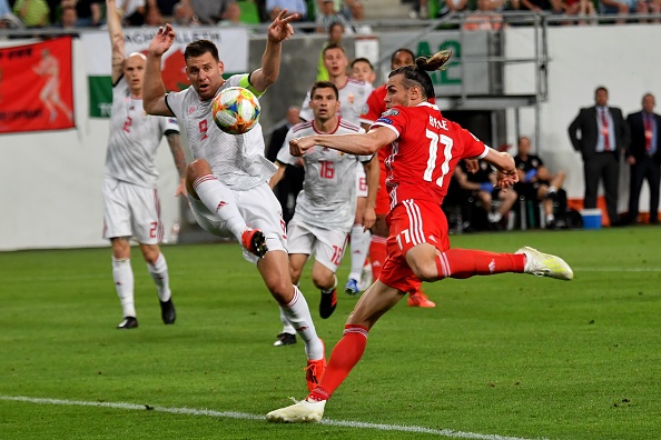 Wales' forward Gareth Bale (R) vies with Hungary's forward Adam Szalai (2nd L) during the UEFA Euro 2020 qualifier Group E football match Hungary against Wales on June 11, 2019 in Budapest. (Photo by ATTILA KISBENEDEK / AFP) (Photo credit should read ATTILA KISBENEDEK/AFP/Getty Images)