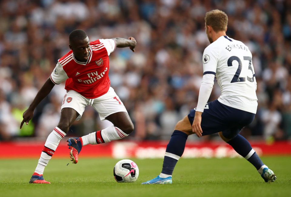 LONDON, ENGLAND - SEPTEMBER 01: Nicolas Pepe of Arsenal runs at Christian Eriksen of Spurs during the Premier League match between Arsenal FC and Tottenham Hotspur at Emirates Stadium on September 01, 2019 in London, United Kingdom. (Photo by Julian Finney/Getty Images)