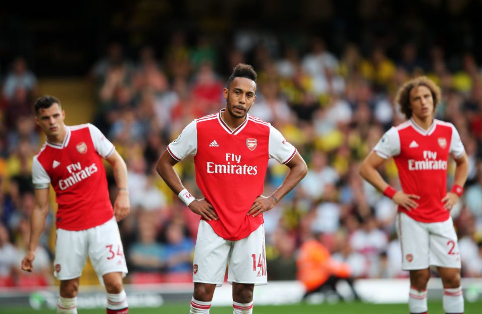 WATFORD, ENGLAND - SEPTEMBER 15:  Pierre-Emerick Aubameyang of Arsenal (14) and team mates Granit Xhaka and David Luiz react during the Premier League match between Watford FC and Arsenal FC at Vicarage Road on September 15, 2019 in Watford, United Kingdom. (Photo by Marc Atkins/Getty Images)
