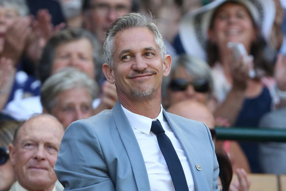Former England footballer and television presenter Gary Lineker stands and waves in the royal box on centre court before the start of the men's singles third round match between Australia's Samuel Groth and Switzerland's Roger Federer on day six of the 2015 Wimbledon Championships at The All England Tennis Club in Wimbledon, southwest London, on July 4, 2015. RESTRICTED TO EDITORIAL USE -- AFP PHOTO / JUSTIN TALLIS (Photo by Justin TALLIS / AFP) (Photo credit should read JUSTIN TALLIS/AFP/Getty Images)
