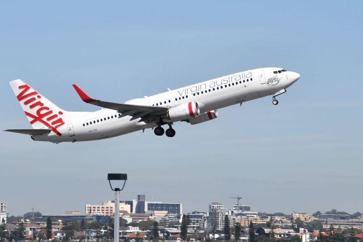 Qantas said the pandemic's "existential crisis" is over despite posting a loss for the third consecutive year