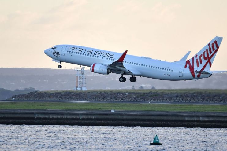 Embattled Virgin Australia has said it will ground all domestic flights except a single daily trip from Sydney to Melbourne due to coronavirus, and is seeking AU$1.4bn (&pound;707m) in government aid.
