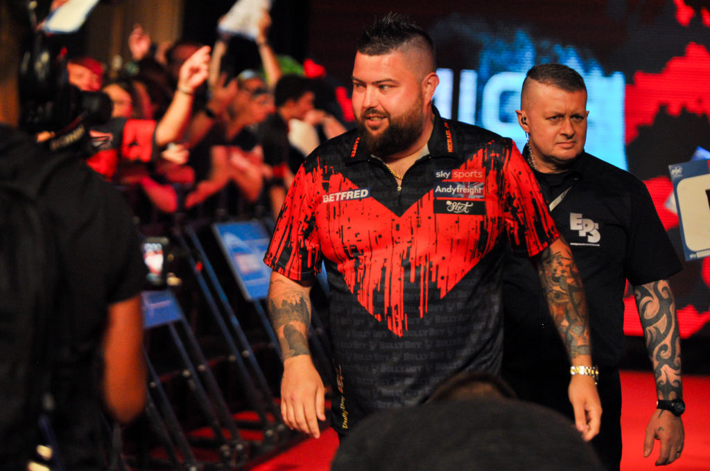 Reigning World Darts Championship winner Michael Smith will start his title defence against either Kevin Doets or Stowe Buntz following yesterday's  draw for the iconic Alexandra Palace tournament. 