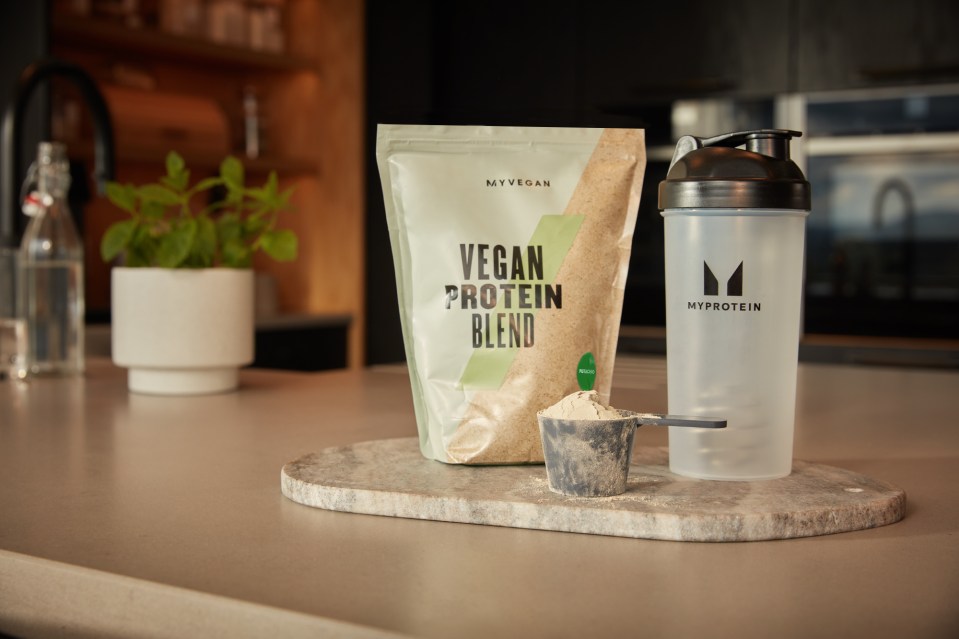 A picture of Myprotein&rsquo;s Vegan Protein Blend and branded water bottle.
