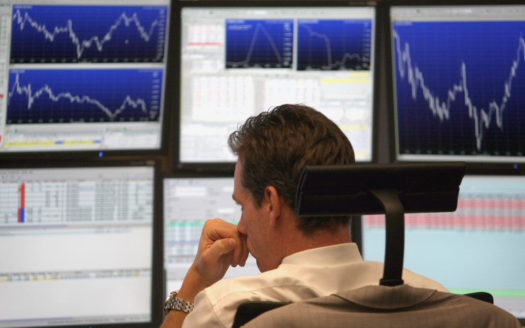 FRANKFURT AM MAIN, GERMANY - SEPTEMBER 30: A trader looks on during a trading session on the floor of Frankfurt stock exchange on September 30, 2008 in Frankfurt am Main, Germany. Due to the weakness of the U.S. economy the German stock market remains volatile. The U.S. stocks took a nosedive in reaction to the global credit crisis and as the U.S. House of Representatives rejected the $700 billion rescue package. (Photo by Ralph Orlowski/Getty Images)