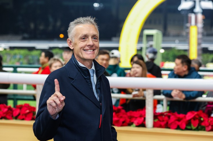 Trainer Mark Newnham celebrating with My Wish after winning the Group Two Sha Tin Trophy, showcasing his stables success.