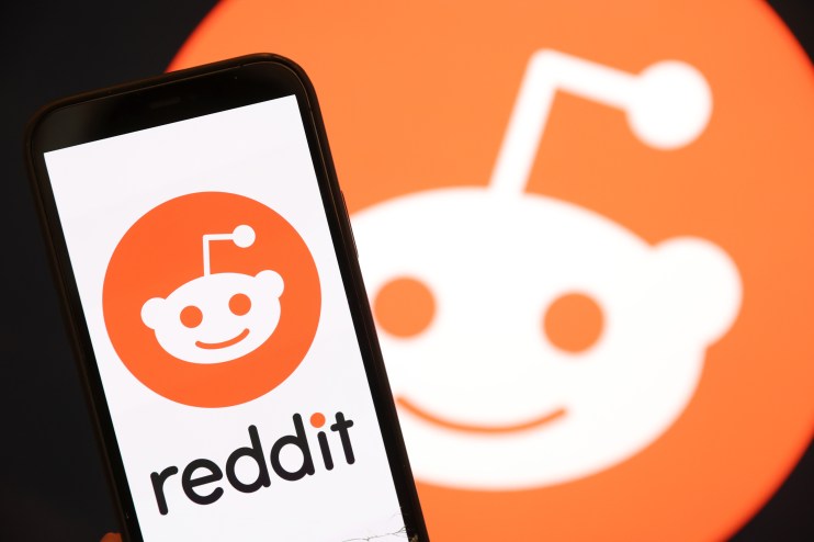 SAN ANSELMO, CALIFORNIA - DECEMBER 16: In this photo illustration, The Reddit logo is displayed on the screen of an iPhone on December 16, 2021 in San Anselmo, California. Reddit has confidentially filed paperwork for an initial public offering (IPO) with the Securities and Exchange Commission. (Photo Illustration by Justin Sullivan/Getty Images)