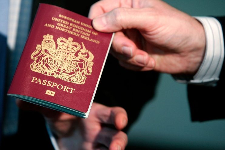 WASHINGTON - OCTOBER 24: A new British biometric European Union passport, which is embedded with a microchip, is shown during a news briefing at the British Embassy October 24, 2005 in Washington, DC. "The new British biometric passport contains features such as an enhanced security chip which will help to make international travel as safe and efficient as possible," said British Ambassador to the United States, Sir David Manning. (Photo by Alex Wong/Getty Images)