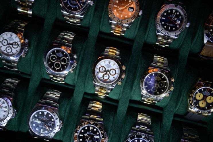 US President Donald Trump's tariffs have impacted the Swiss watch market. (Photo by Leon Neal/Getty Images)