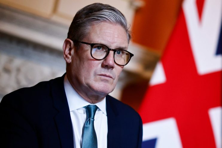 LONDON, ENGLAND - JULY 16: British Prime Minister Keir Starmer reacts as he meets with Defence Secretary John Healey and Member of the House of Lords George Robertson at 10 Downing Street on July 16, 2024 in London, England. (Photo by Benjamin Cremel - WPA Pool/Getty Images)