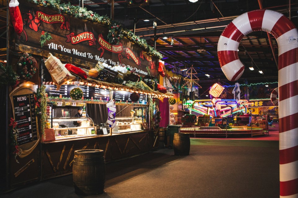Festive winter scene at Winter Funland 2018 with families enjoying ice skating and holiday decorations