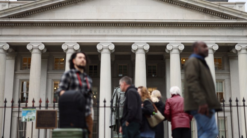 U.S. Treasury building facade with American flag, highlighting government finance and economic policy decisions