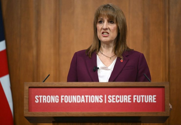 Rachel Reeves discussing economic policy at a press conference, emphasizing fiscal strategies and future economic plans.