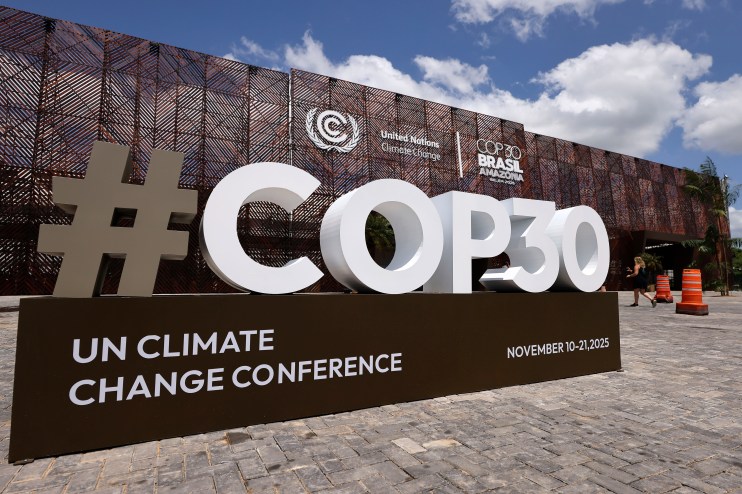 Delegates discuss climate strategies at COP30 conference with global leaders in a modern, sustainable venue.
