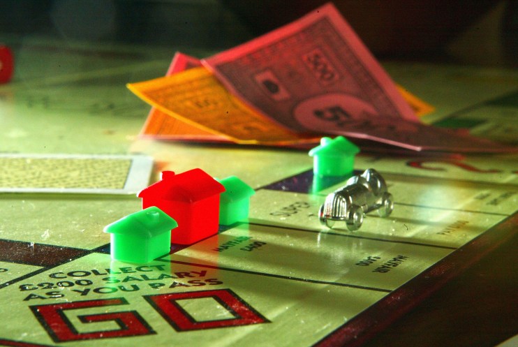 Classic Monopoly board game with colorful properties, iconic tokens, and dice capturing the essence of strategic real esta...