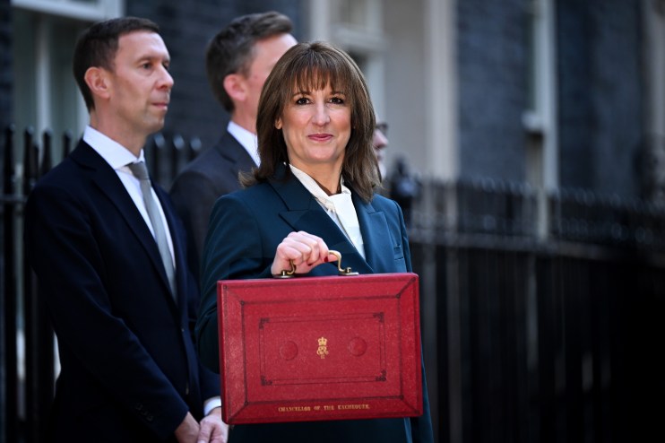 Rachel Reeves presenting budget day highlights at a press conference, emphasizing economic strategy and fiscal planning.
