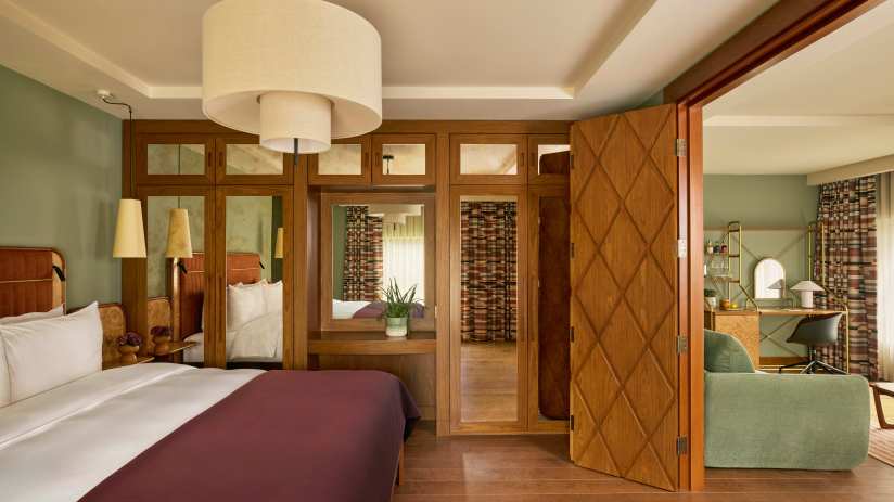 Sir DSQ Sir Devonshire Suite with elegant decor by Martin Morrell, highlighting luxury and sophistication in business sett...