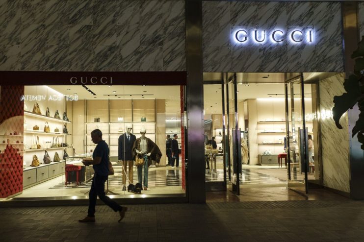 Gucci fashion collection showcase featuring models on the runway wearing the latest luxury clothing designs