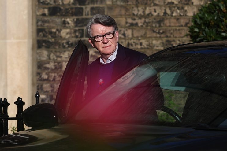 Lord Mandelson giving a speech at a business conference, addressing economic policies and industry challenges.