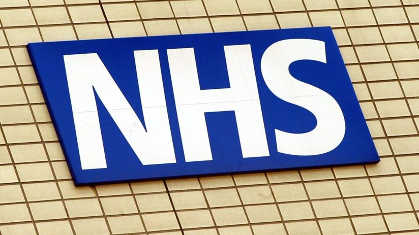 NHS staff in uniform providing care at a hospital, showcasing dedication and teamwork in the healthcare sector