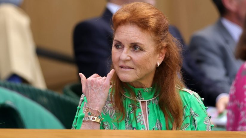 Sarah Ferguson attending a public event, wearing a stylish outfit, engaging with audience, highlighting her public persona