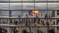 Aerial view of Heathrow Airports bustling terminals with parked airplanes and surrounding infrastructure