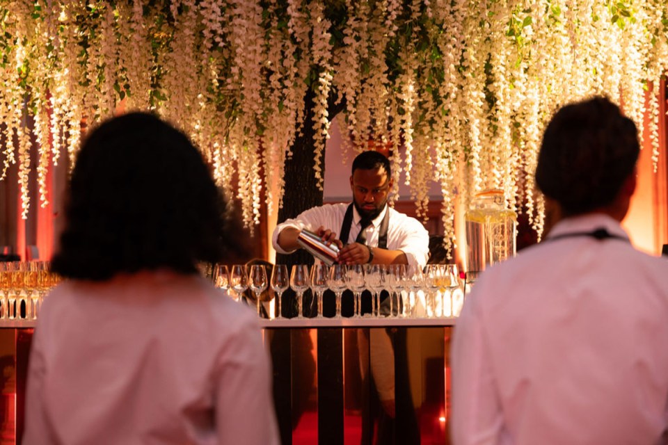 City PM Awards celebration at a bustling bar with attendees networking and enjoying the vibrant atmosphere of the event