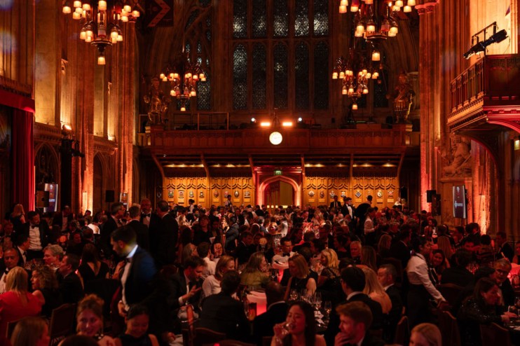 City PM Awards ceremony with attendees networking in a formal setting, capturing an atmosphere of business excellence and ...