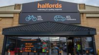 Halfords store exterior showcasing signage and entrance, highlighting the brands presence in the retail automotive sector.