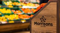 Morrisons supermarket exterior with branded signage, showcasing entrance and storefront, highlighting retail location.