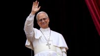 Pope Leo depicted in traditional papal attire delivering a speech at the Vatican, surrounded by historical architecture.