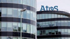 Atos logo prominently displayed on a modern office building, highlighting its corporate presence and technological expertise.