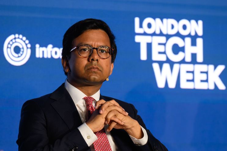 Kanishka Narayan, wearing glasses and a suit, speaks at London Tech Week, with the event logo visible.