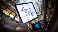 LSEG logo on a large screen within a modern building displaying stock market data and world indices
