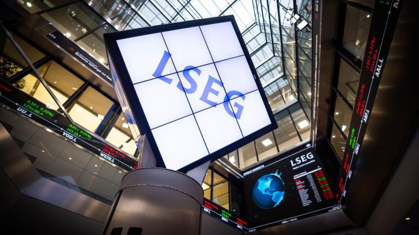 LSEG logo on a large screen within a modern building displaying stock market data and world indices