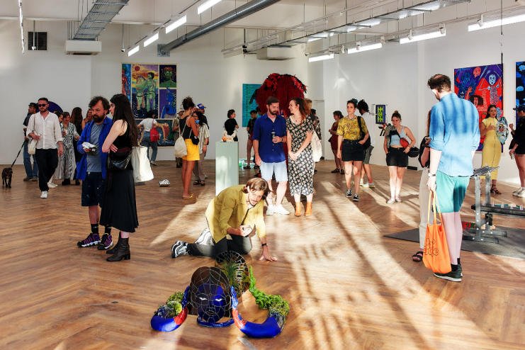 Visitors at the Square Mile art gallery viewing diverse contemporary artworks and sculptures.