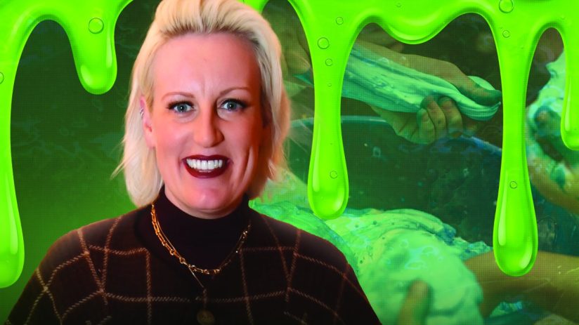 Blonde woman smiling with green slime background, children playing with goo, Gootopia online experience