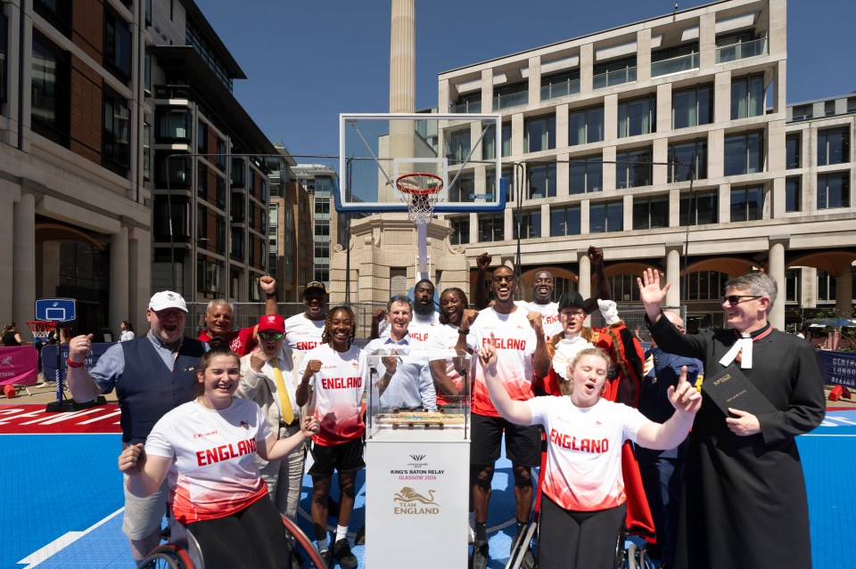 Team England athletes and officials with the Kings Baton at a London sports festival.